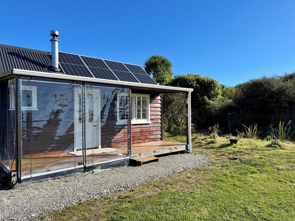 Hand crafted cabin with recycled windows and door