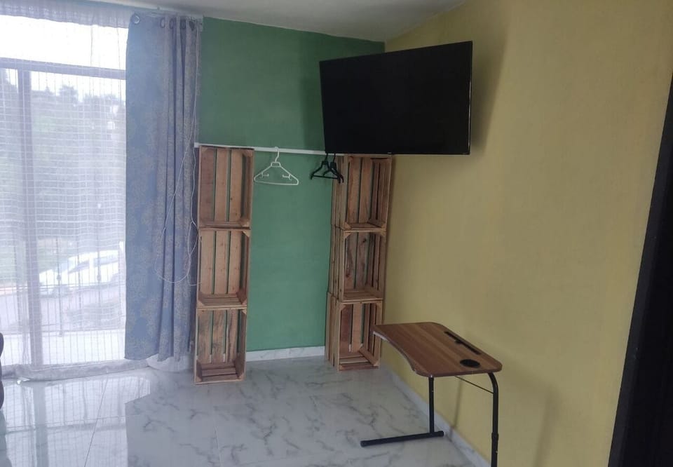 Comfort Quadruple Room, Balcony, City View | Living area