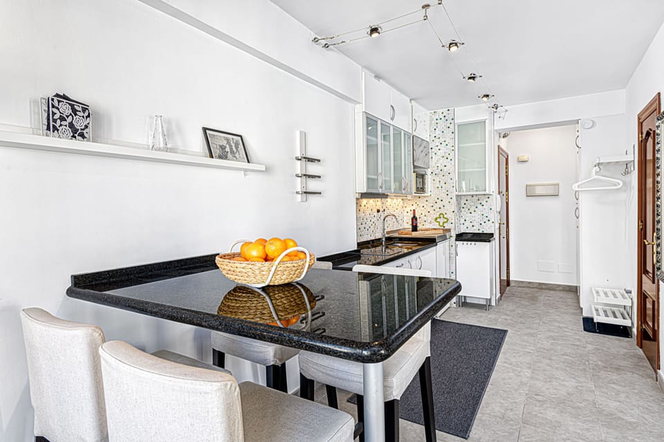 Standard Apartment, Partial Sea View | Living area | 50-inch TV with cable channels