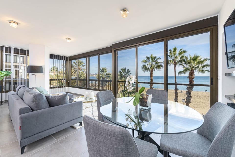 Luxury Apartment, Sea View | Living area | 50-inch TV with cable channels