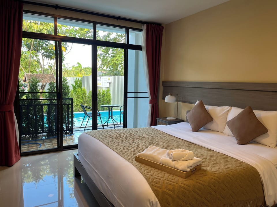 Deluxe Double Room, Pool Access | Minibar, desk, laptop workspace, blackout drapes