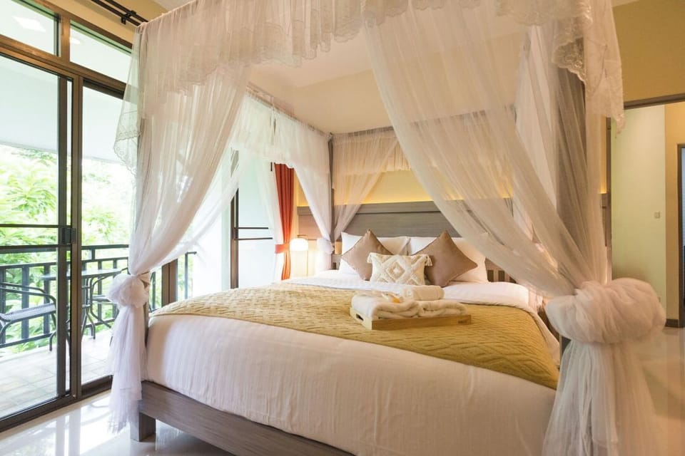 Deluxe Double Room, Pool View | Minibar, desk, laptop workspace, blackout drapes