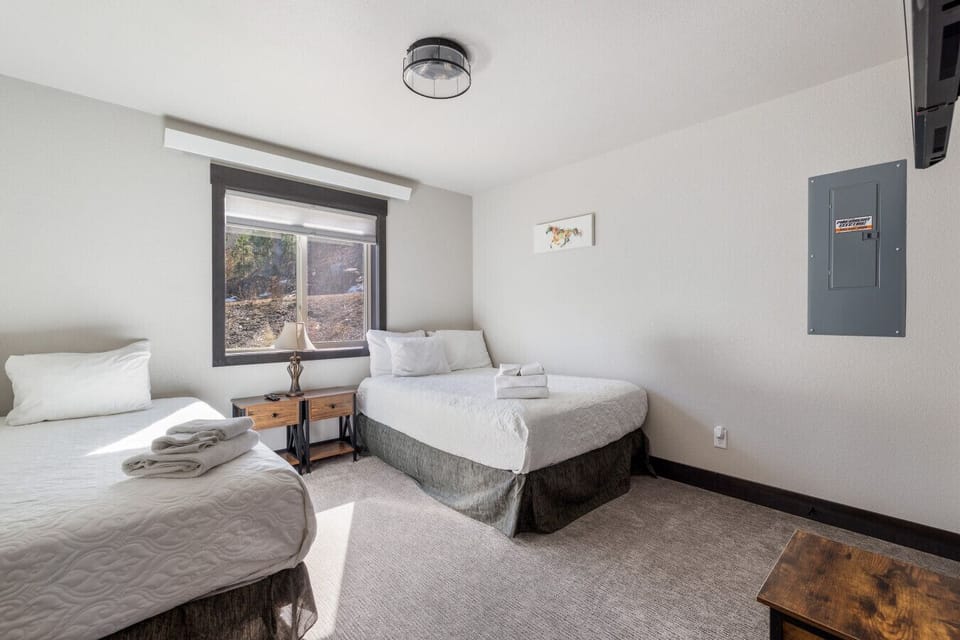 A cheerful bedroom with two twin beds, perfect for sharing and restful stays.