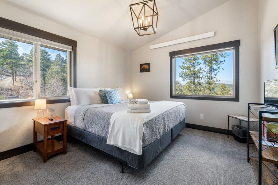 A serene bedroom featuring a plush king bed, perfect for restful nights and ultimate comfort.