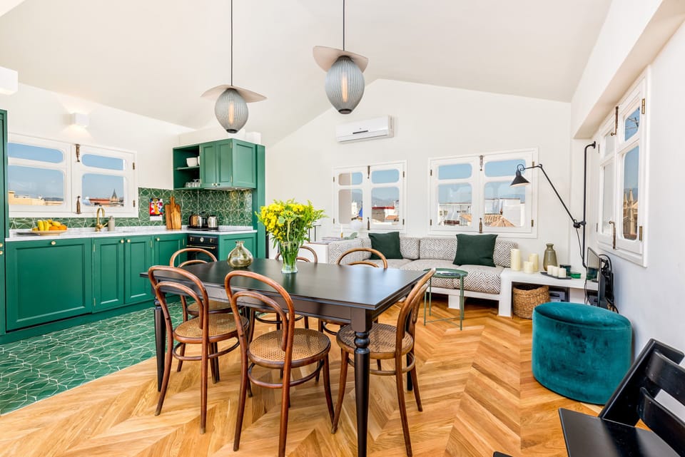 Deluxe Duplex, City View | Living area | 50-inch LCD TV with cable channels