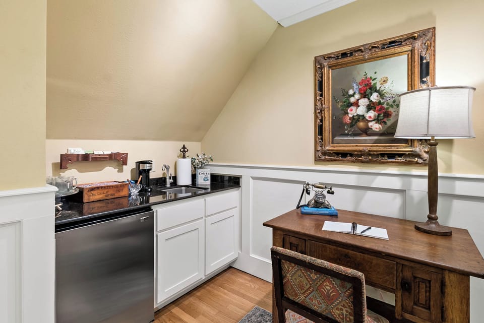 Stairwell landing, coffee service and upstairs refrigerator