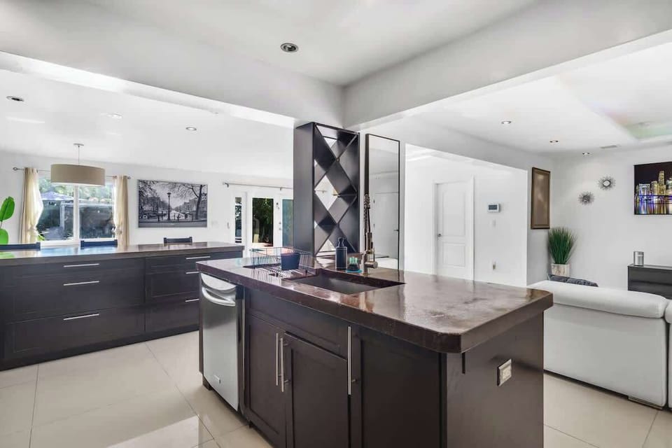 Relax in style at our modern open-concept retreat! This chic vacation rental features a sleek kitchen, cozy living area, and natural light galore—perfect for your next getaway. Ideal for families, couples, or remote work escapes. Book your stay today