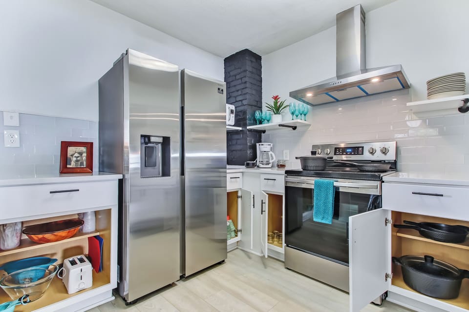 Bright fully equipped modern kitchen ready for cooking and cozy family moments.