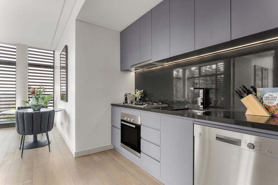 One Bedroom Apartment | Private kitchen | Full-size fridge, microwave, oven, dishwasher