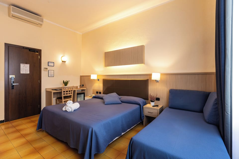 Triple Room | Down comforters, minibar, in-room safe, desk