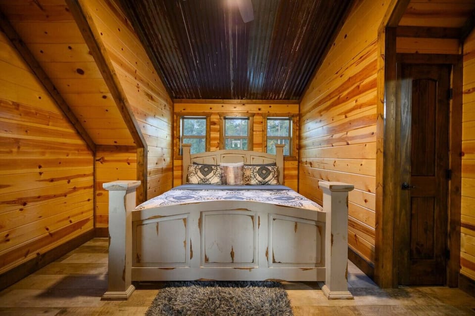 Unwind in style—our cabin’s bedroom offers a peaceful retreat with rustic charm and modern comfort.