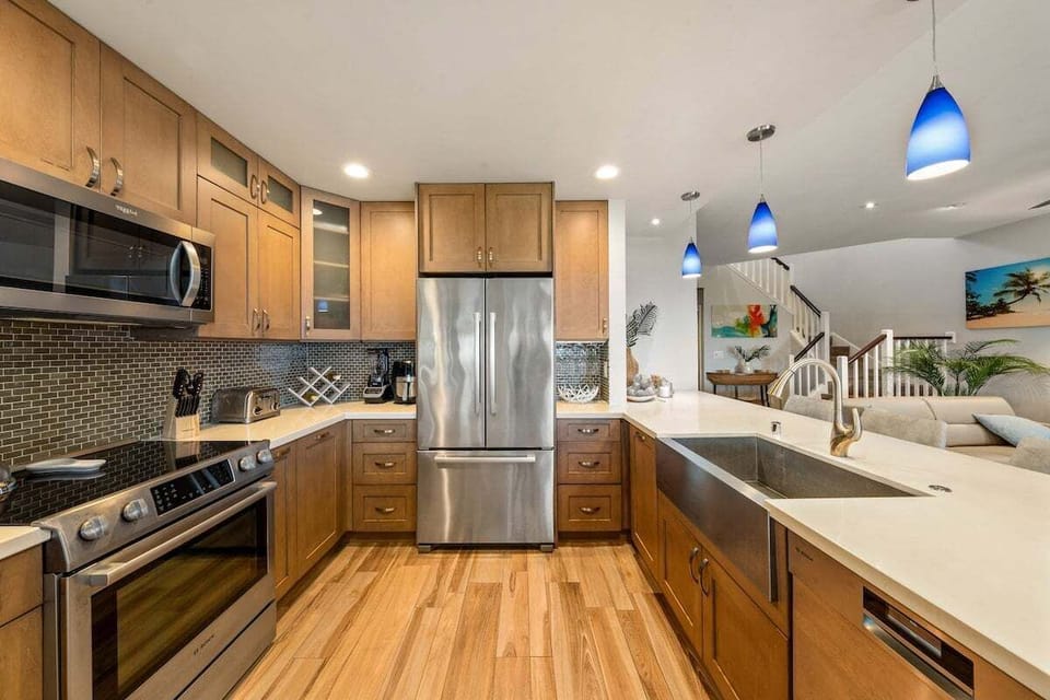 Fully remodeled kitchen with stainless steel appliances, ample counter space, and modern design ideal for family meals.