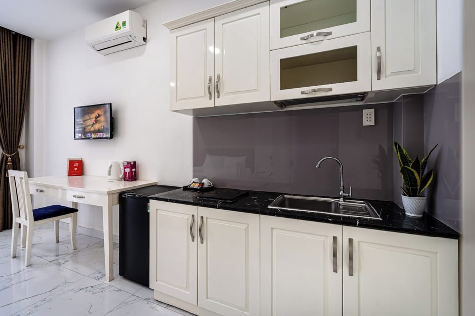 Premium Studio, City View | Private kitchen | Mini-fridge, cleaning supplies, paper towels, dining tables