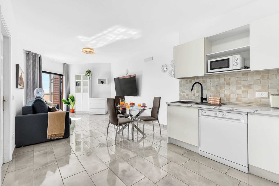 Kitchen with Dishwasher, Oven, Stovetop, Fridge, Microwave, Electric Kettle and Coffee Machine