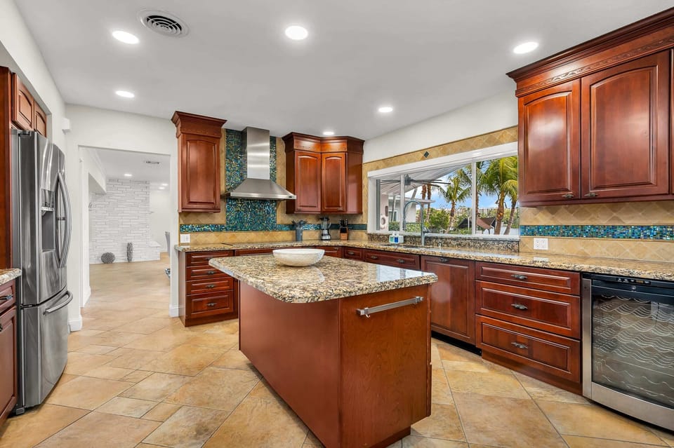 Open kitchen with pool and lake views.