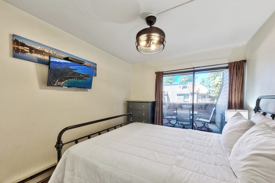 Drift off in your comfortable bedroom with private balcony access for fresh mountain air.