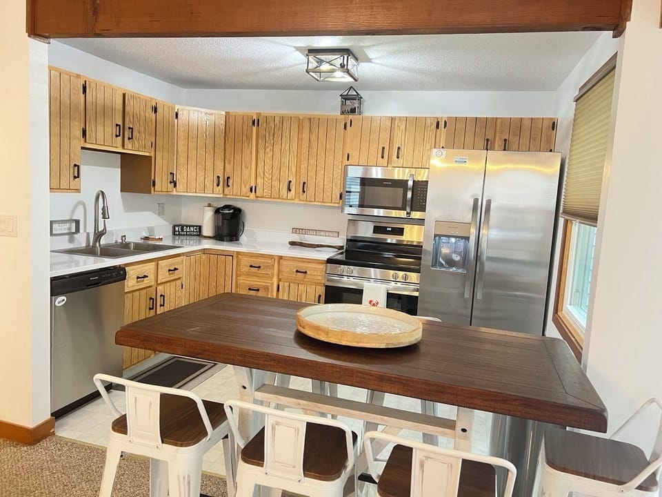 Full kitchen with stainless appliances and dining for the family.