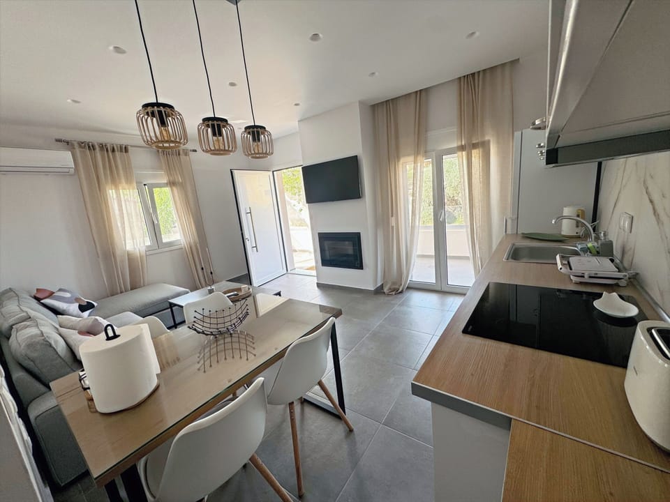 Kitchen with all amenities and dining table.