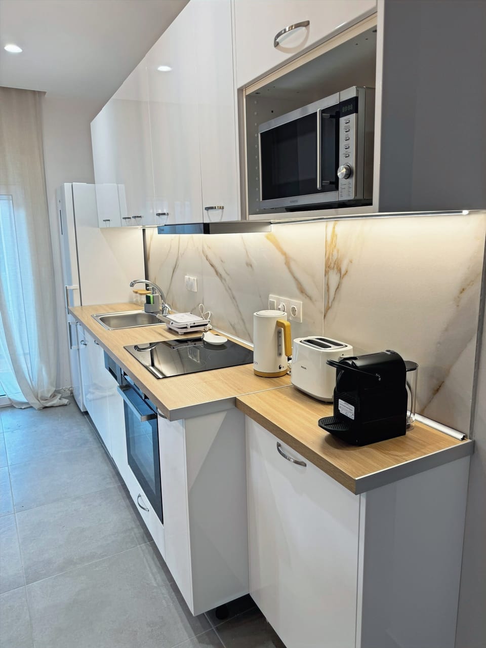 Kitchen with all amenities and dining table.