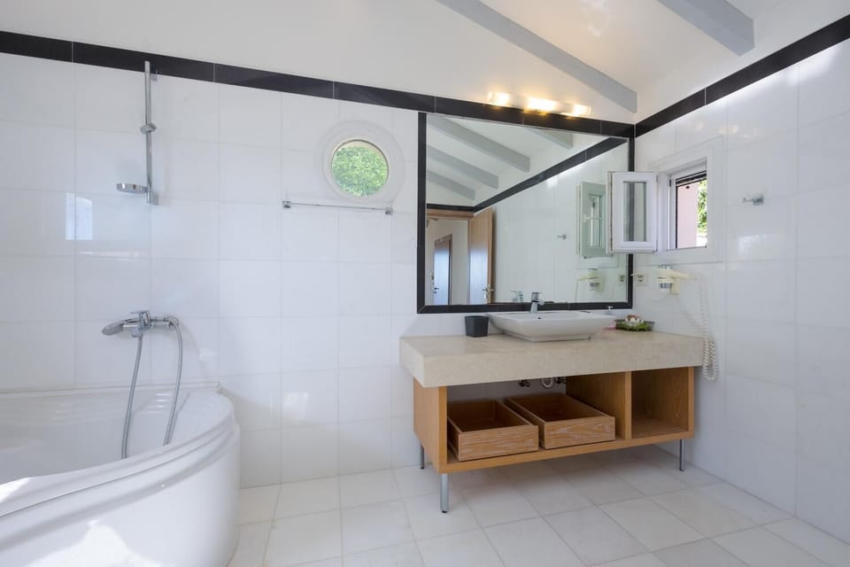 En suite bathroom with shower and bath