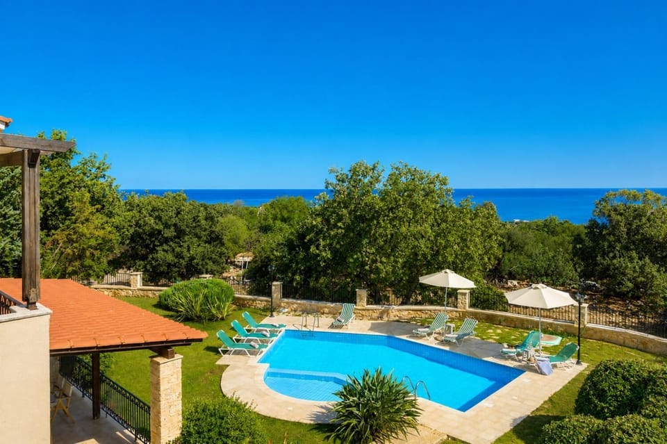 Private pool, terrace, and garden with sea views