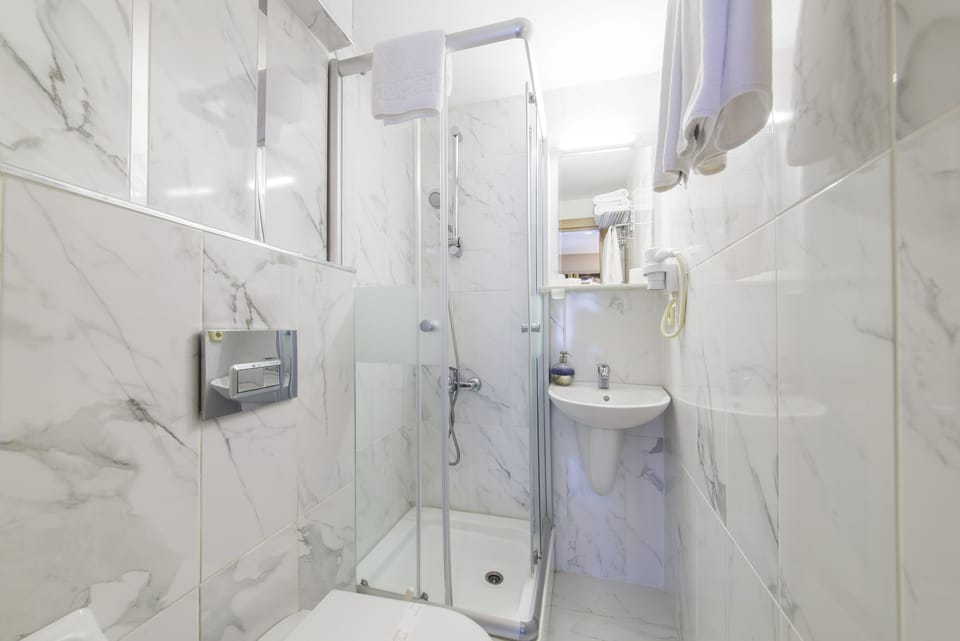 Shower, hair dryer, slippers, towels