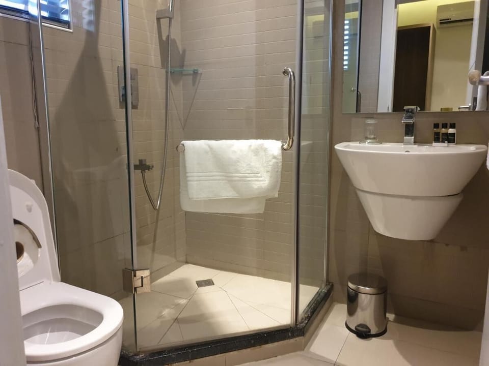 Bathtub, slippers, towels, soap
