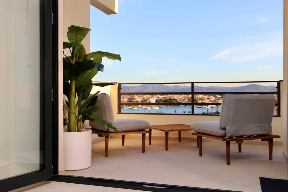 Balcony seating seaview evening light Holiday Via de Filippi 14A Olbia Rental 12 com