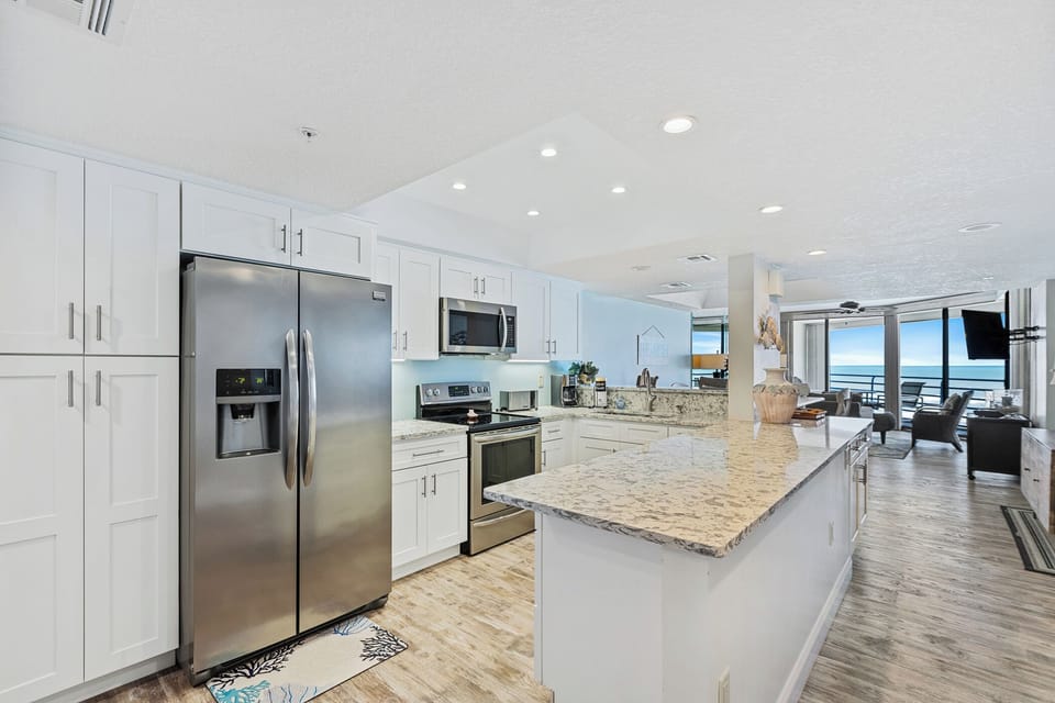 Fully updated kitchen. Wonderful flow from the kitchen to the dining area, living area, and balcony.