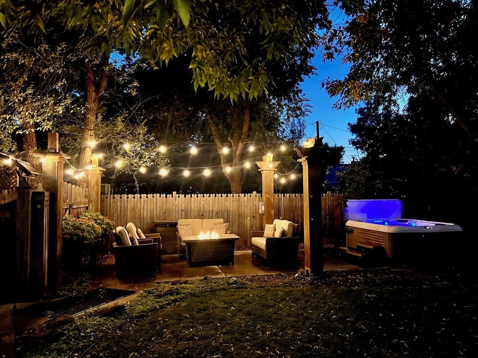 The private backyard has a fire pit and hot tub!