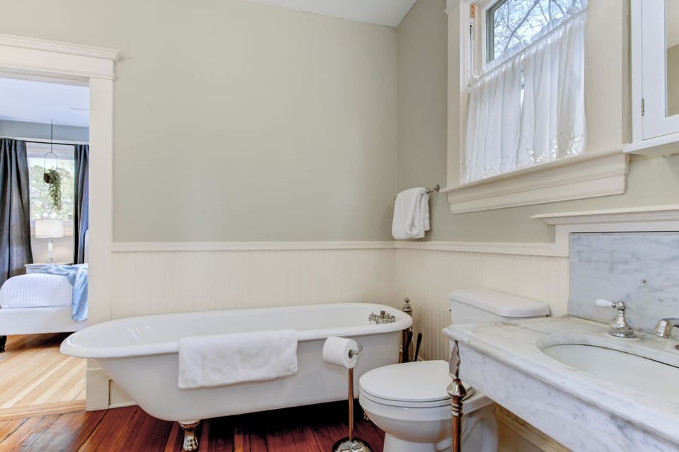 Second Floor Full Bathroom with doors to Treetop Room and Gilded Room. 