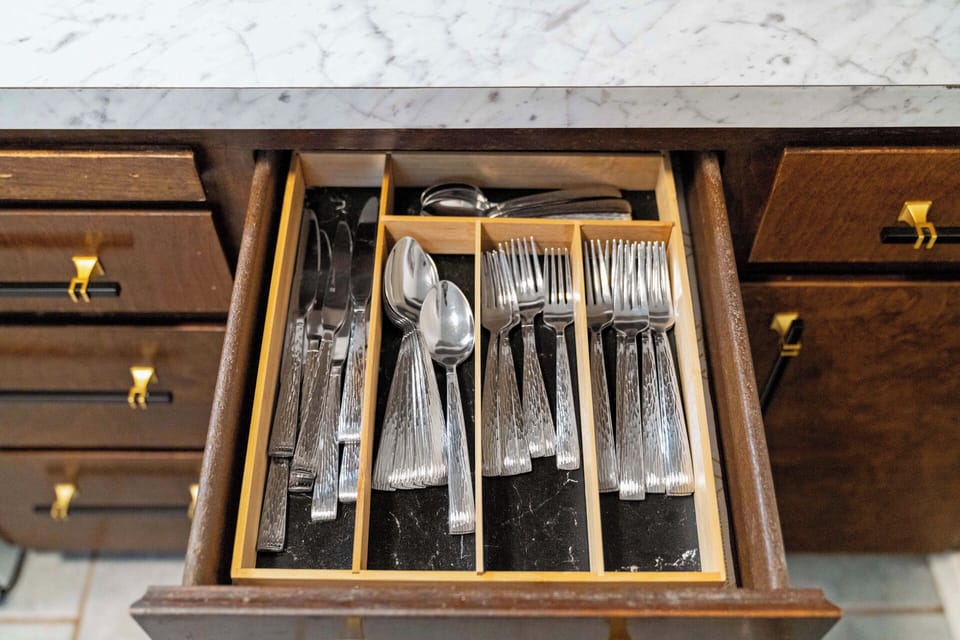 Plenty of silverware and dishwater