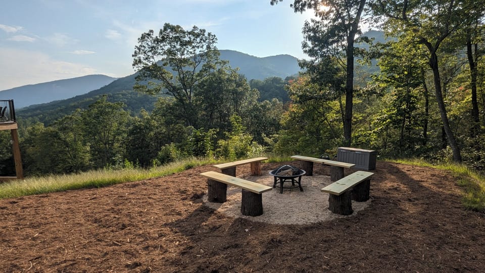 New wood fire pit next to the house with year-round views