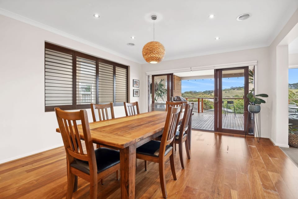 The home's layout promotes a fluid transition between the kitchen, dining, and lounge areas