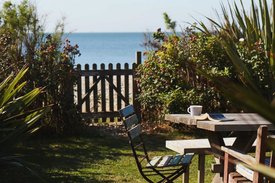 Unwind in our beautiful garden with direct access to the beach, perfect for morning coffee or an afternoon read