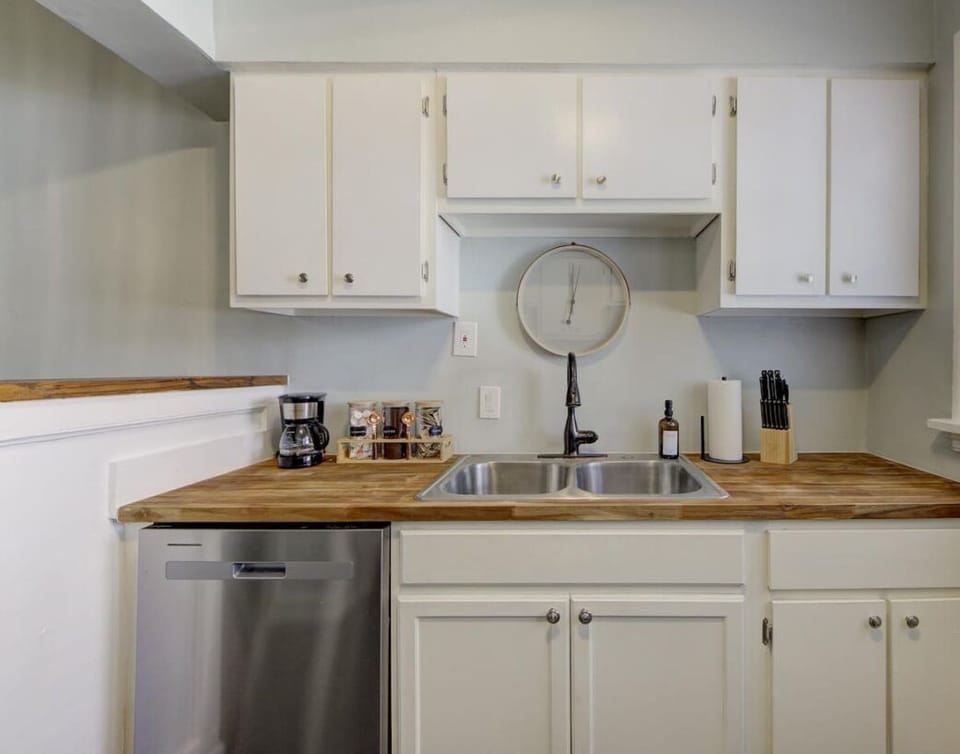 Enjoy the convenience of a modern kitchen with a dishwasher, spacious sink, and all the essentials for a hassle-free stay.