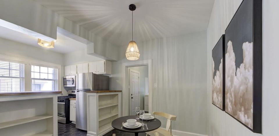 Enjoy a cozy meal in this stylish dining space, perfect for intimate dinners or a relaxing morning coffee.