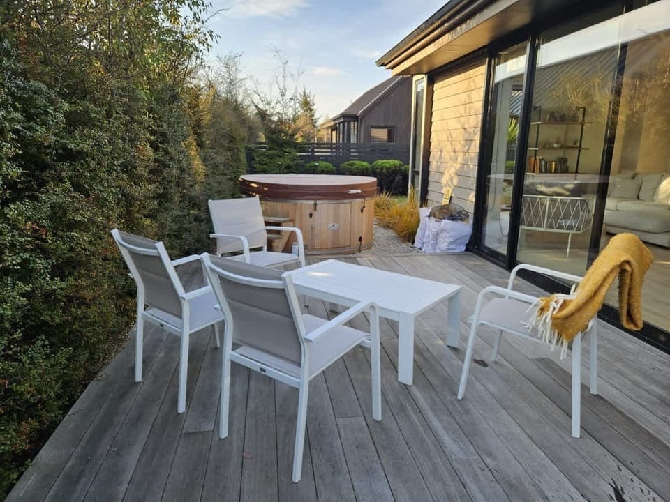 Relax in the private backyard with Hot tub and outdoor patio 