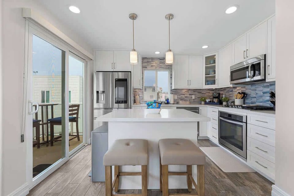 Full size kitchen w/ balcony off the side