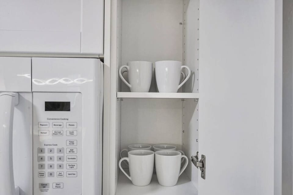 Start your morning right. Our kitchen is equipped with a microwave and a full set of clean mugs, ready for your coffee or tea. Everything you need for a cozy beverage is conveniently at your fingertips.