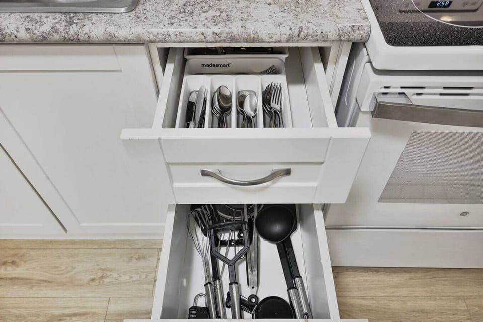 Feel at home with a fully equipped kitchen. From cooking utensils to silverware, everything is neatly organized and ready for you to prepare a delicious meal. Enjoy the convenience of having all the tools you need right at your fingertips.