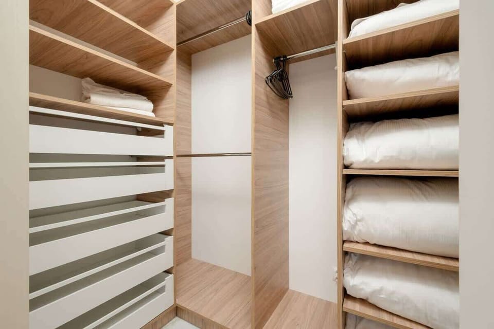 The wardrobe provides plenty of storage space for personal belongings.
