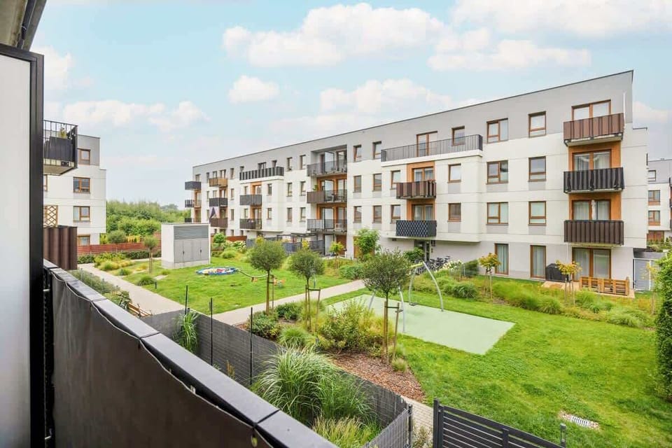 Another exterior view of the landscaped courtyard and apartment complex.