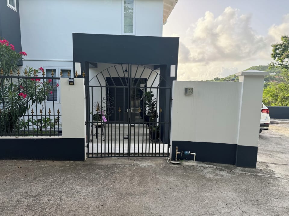 Private entrance with gated secure drive way .