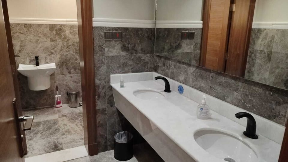 Separate tub and shower, hair dryer, bathrobes, slippers