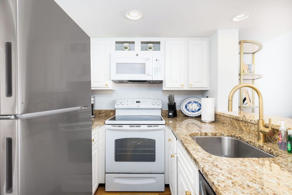 Coastal Kitchen highlighting updated finishes, fully equipped kitchen — steps from the beach