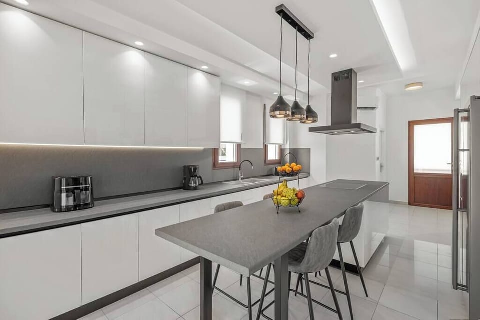 KITCHEN | Your fully stocked kitchen awaits. Enjoy a selection of snacks, a variety of teas and coffees (including decaf), and a dozen of fine spices. It has direct access to the outdoor areas and the pool.
