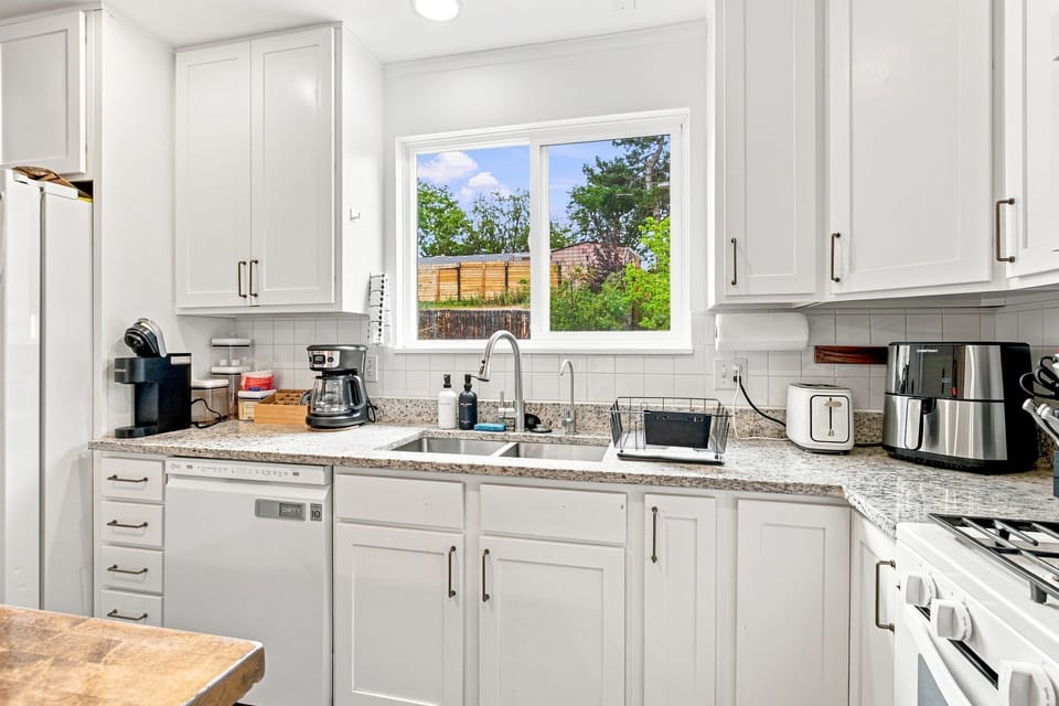 A spacious kitchen with everything you need to prepare meals during your stay.