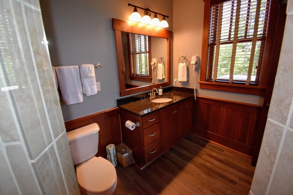 1st floor bathroom with shower, sink and toilet