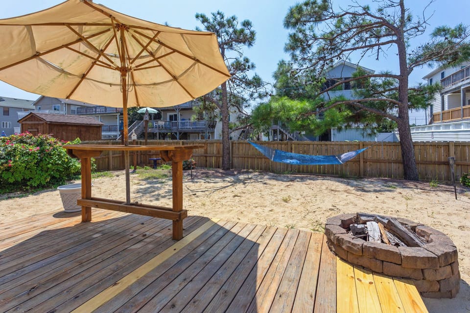 The Outdoor Entertainment Area with a firepit is the ideal spot to soak up the sun and have some fun!